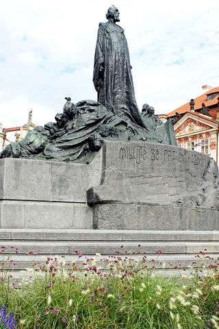 The large monument in the middle of the Old Town Square in Prague is the statue of the reformer Jan Hus.