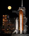 Space Shuttle Discovery under a full moon, 03-11-09.jpg